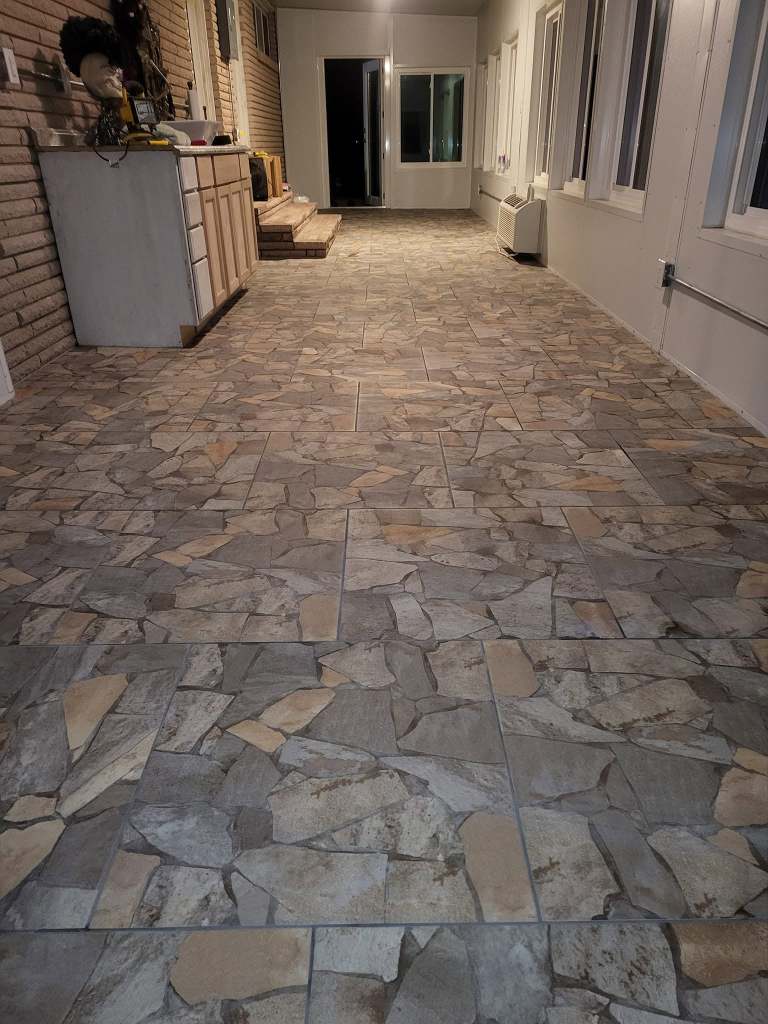 Custom stone-look tile flooring installation completed by Floor Masters of Acadiana in Lafayette, Louisiana.
